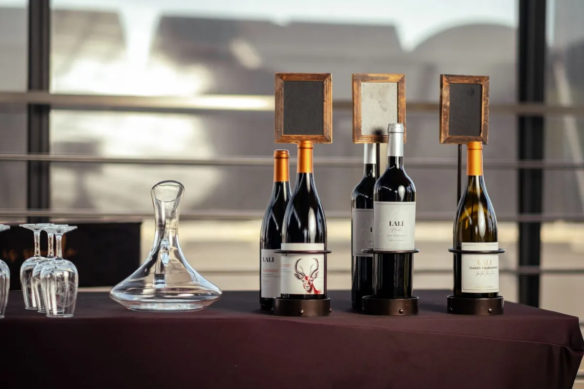 A stylish wine presentation featuring bottles and a glass decanter, perfect for a North Fork wine tour.